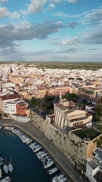 Aerial drone view over the historic city center of Ciutadella, Menorca Island, Balearic islands, Spain. Medieval buildings. Marina port and boats