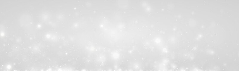 Fototapeta premium Silver snow dust glimmers, glowing light, sparkle, shimmer, glitter airy bokeh. Twinkle particle, stardust highlights flare sparks, snow, glare, lens flare magical festive PNG winter illustration. 