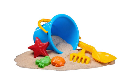 Brightly colored children's beach toys on a small pile of sand, isolated on transparent background. © Isla