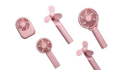 Set of scattered pink portable handheld fans isolated on transparent background © Dale