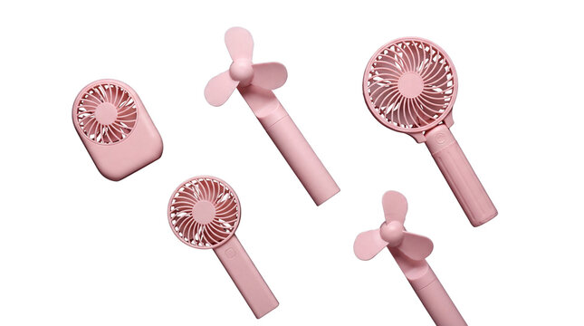 Set of scattered pink portable handheld fans isolated on transparent background