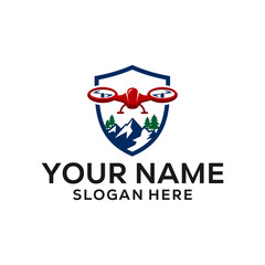 Obraz premium Drone and Mountain Shield Logo Design for Adventure and Photography