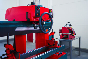 Naklejka premium Red industrial machines in a workshop.