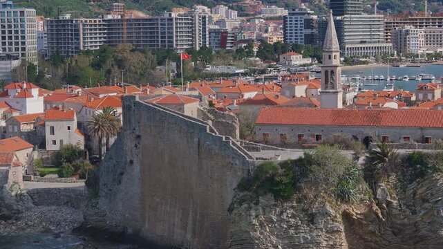 Budva City Walls with Modern City in Background Aerial
