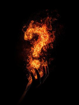 Flaming question mark on dark background mystery uncertainty and curiosity concept