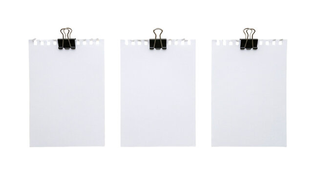 Three blank rectangular notebook paper sheets with torn perforated top edge held by bulldog clips on a transparent background