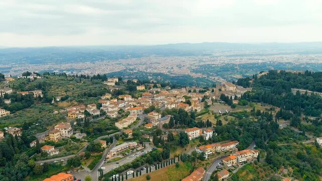 Florence, Italy. Fiesole is a city in the Tuscany region, in the province of Florence. The city of Florence in the background of the panorama. Drone footage