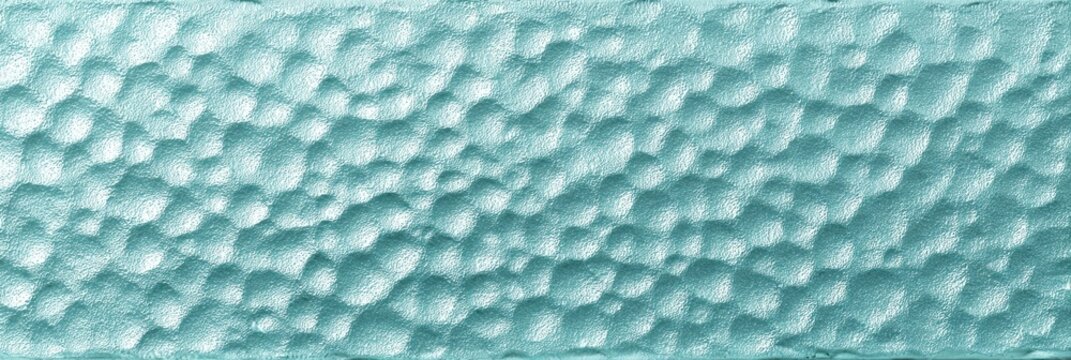 This pale aqua hammered glass texture tile displays a dimpled surface with a frosted finish. The decorative rectangular panel has a translucent blue-green color and a bumpy pattern.