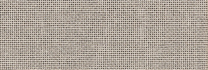 A high-resolution close-up view of an undyed microfiber fabric texture with a fine woven pattern. The light beige material shows a detailed grid of threads for a clean background.