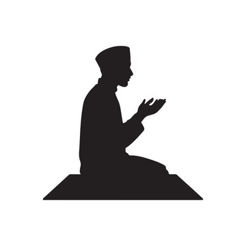 Silhouette of a Muslim man in traditional clothing praying on a prayer mat with hands clasped in supplication