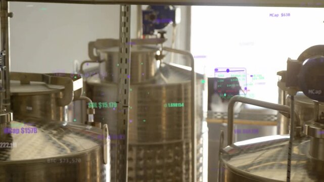 Camera panning left to right, stainless-steel tanks centering, HUD green purple tracking inspection