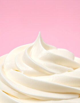 Closeup of Whipped Cream Swirl on Pink Background
