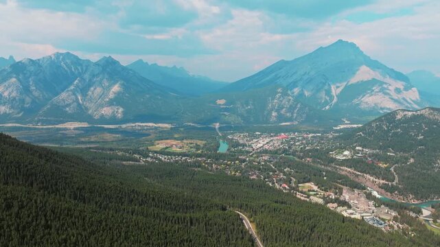Aerial Revealing shot, Town of Banff, Morning shot. Banff National Park, Alberta, Canada.