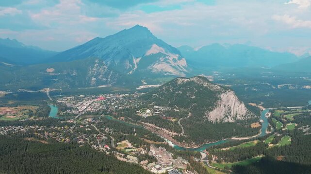 Aerial Revealing shot, Town of Banff, Morning shot. Banff National Park, Alberta, Canada.