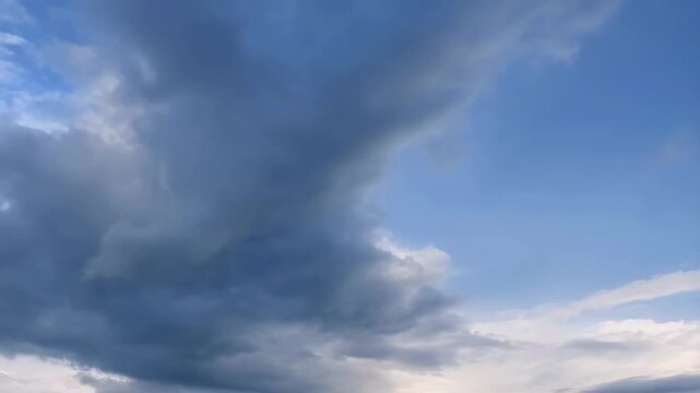 Dynamic cloud formations transitioning from stormy to clear skies. Capturing the beauty of nature's weather changes and the calming effect of blue skies