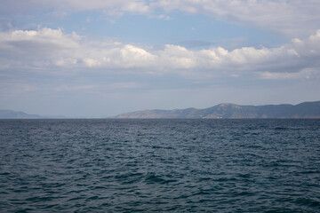 Fototapeta premium Sea view from the beach at Evia Island, Pefki village, Greece, coastal landscape and summer scenery.