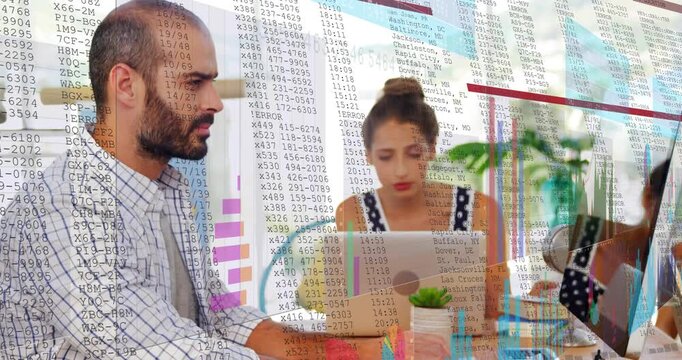 Typing coworkers in checked shirt and patterned top working at shared desk with laptop and charts