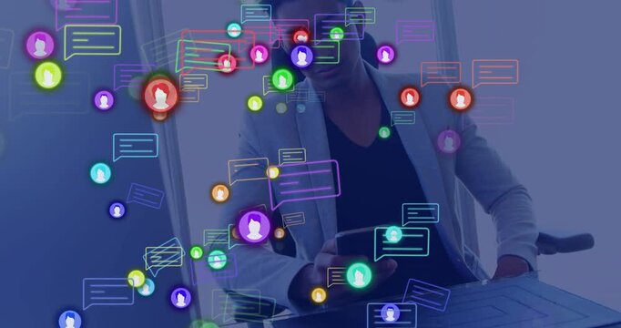Noticing floating icons rising, Indian man tapping phone to check messages at desk in light blazer