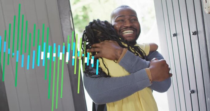 Arriving father in blue sweater greeting daughter in yellow dress at front door, with waveform