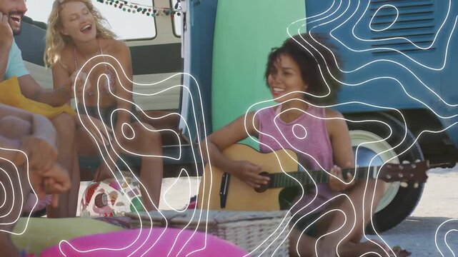 Guitarist playing on beach van causing overlay growing over music crew panning left pals singing