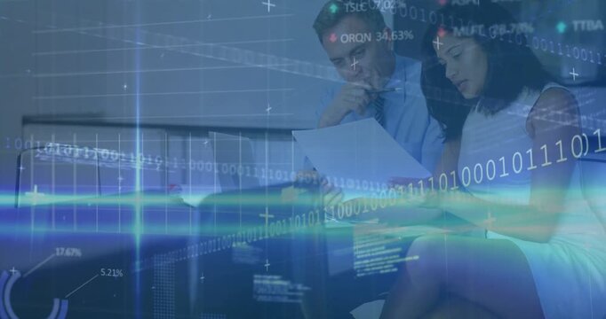 Vertical video: Picking document, colleagues in suits checking papers at office with laptop charts