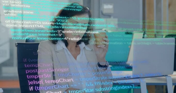 After sipping cup woman at desk checking laptop code picking phone while tech overlay hiding laptop