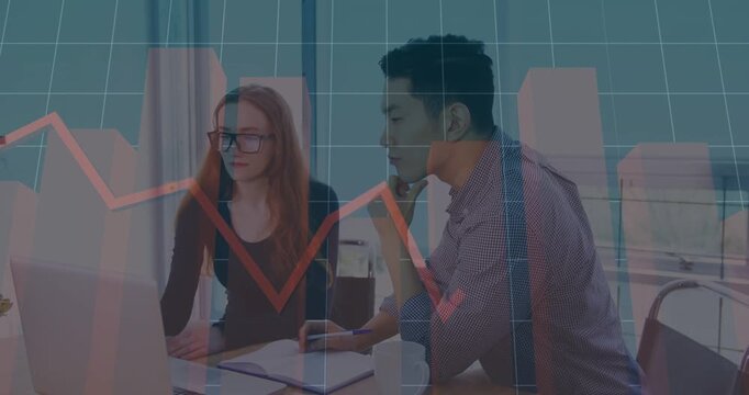 Diverse coworkers sitting at desk, analyzing trends on monitor as red chart overlay appearing
