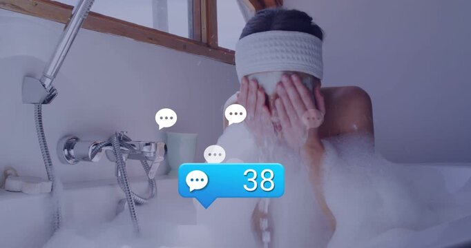 Woman cupping and massaging foam in bathtub for skincare reacting to chat overlay counting messages