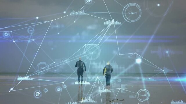 Vertical video: Walking seniors accelerating to sea on beach in wetsuits with yellow board overlay