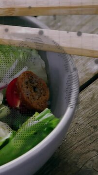 Vertical video: Camera panning down, halftone map drifting over sticks, showing salad for marketing