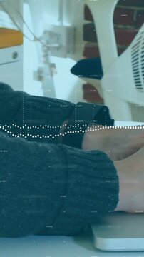 Vertical video: Office user putting hands on laptop and typing email while waveform overlaying keys