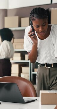 Phone call, stress or black woman with laptop for shipping error, distribution problem or talking. Mobile, frustrated entrepreneur or chat for ecommerce mistake, order fail and headache in office