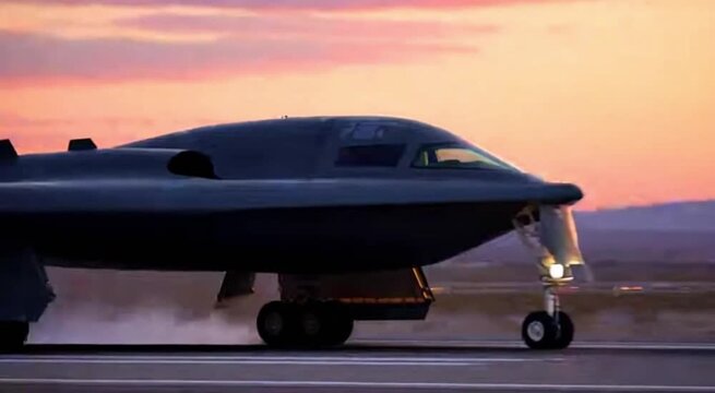 Military B2 Spirit Stealth Bomber Landing On Runway