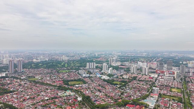 Aerial view of Petaling Jaya SS3 skyline in Malaysia, showing dense residential areas, city expansion, and urban landscape under soft daylight conditions. UHD.