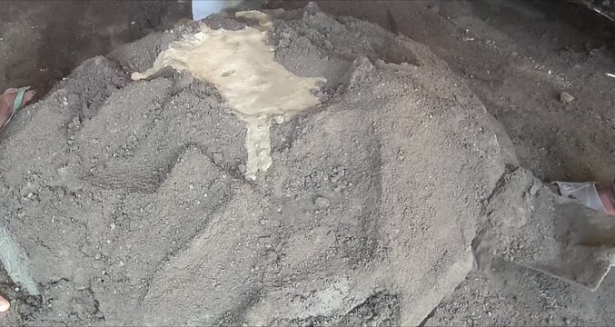 video of making cement and sand mixture for building