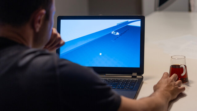 mechanic man at auto service using check up device