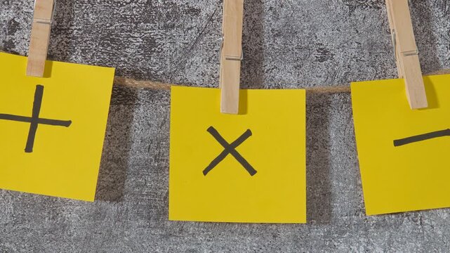 yellow sticky notes plus and minus signs