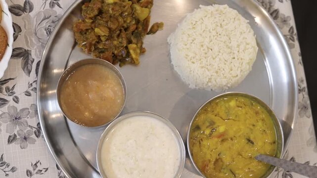 Indian thali with dal rice curd and chutney