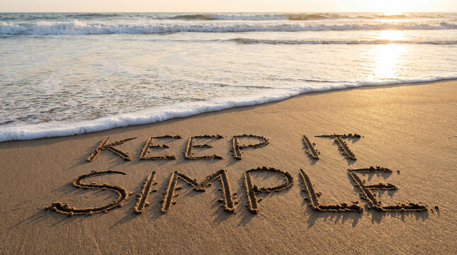 "Keep It Simple" Message Written in Sand on Tropical Beach at Sunset