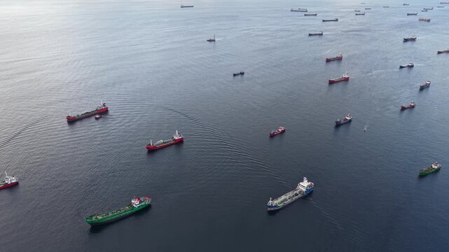 Aerial view of giant cargo ships and ocean-going transport fleets on the sea.