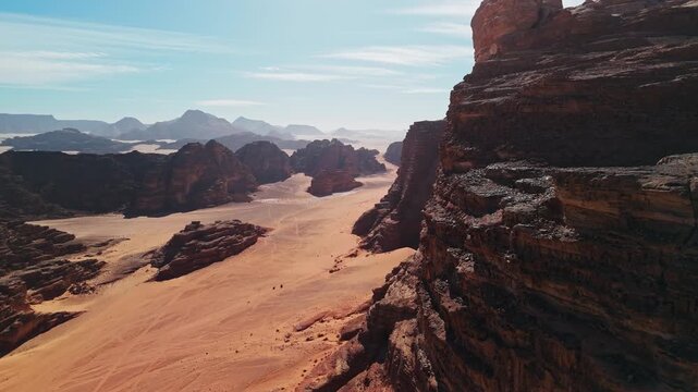 Close drone in around big rocky mountains in wadi rum desert in jordan