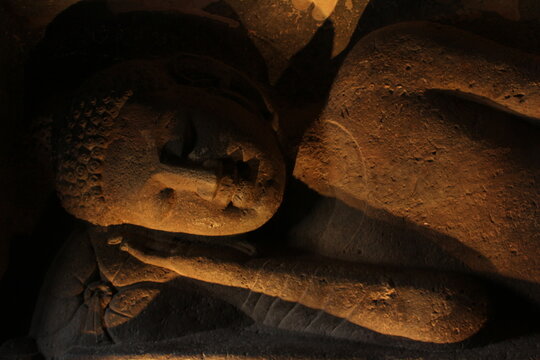 Ancient rock-cut cave temple architecture with detailed stone stone.