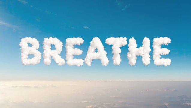 A beautiful and calming of a blue sky with the word BREATHE written in fluffy white clouds, evoking feelings of serenity and peacefulness.