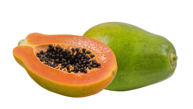 Halved orange papaya and whole green papaya fruit