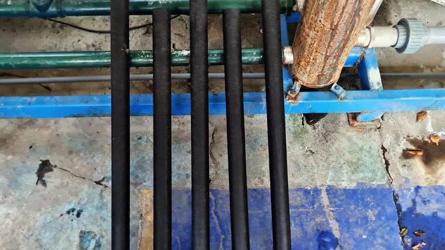 Sidoarjo, Indonesia - 3 April 2026: Industrial Water Filter Pipes System Close Up of Filtration Equipment and Plumbing Infrastructure