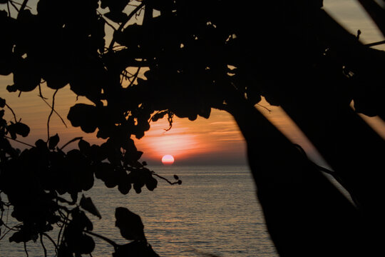 Sunset over sea with silhouette in Ngapali, Myanmar.