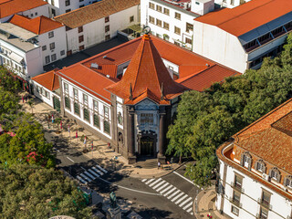 Bank of Portugal, Funchal, Madeira, a historic building with elegant architecture and red tiled roof in the city center.