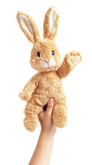 Obraz premium Hand raising rabbit puppet plush cute toy.