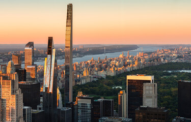 Obraz premium New York City skyline at sunset. Elevated view of supertall skyscrapers along Billionaires Row in Midtown Manhattan, with Central Park, the Upper West Side and Hudson River