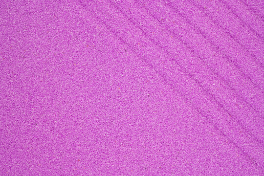 Vibrant purple decorative sand or salt texture background with wavy lines